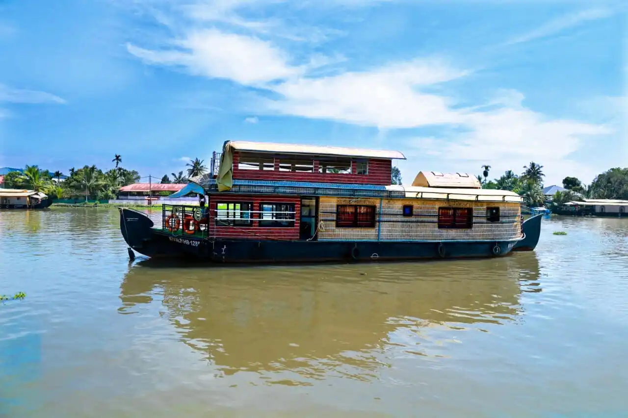 Houseboat cruising through the Alleppey river