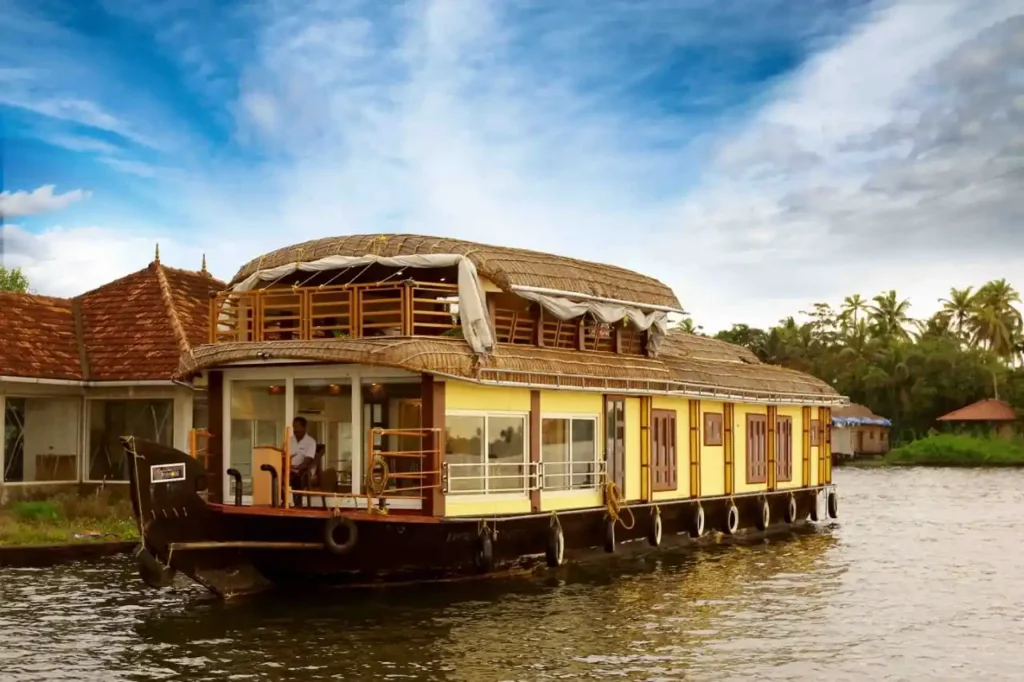 a traditional houseboat docked at a river side