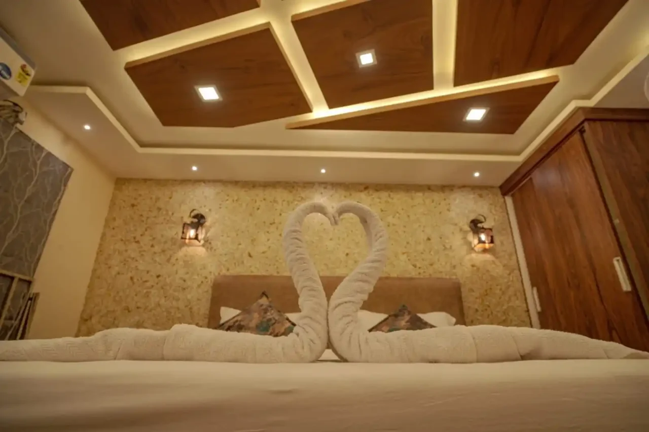 swan shaped towel on a houseboat bedroom